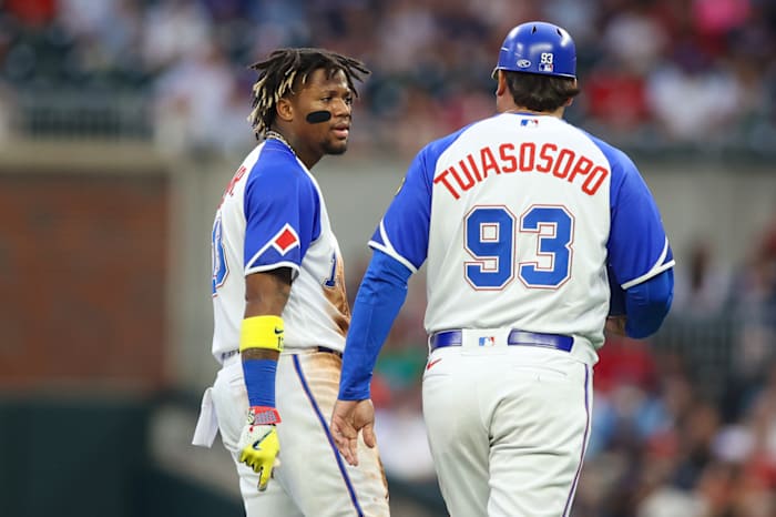 Jul 28, 2023; Atlanta, Georgia, USA; Atlanta Braves right fielder Ronald Acuna Jr. (13) reacts after being thrown out at second with third base coach Matt Tuiasosopo (93) against the Milwaukee Brewers in the first inning at Truist Park.